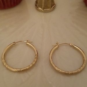 14K gold hoop earrings.